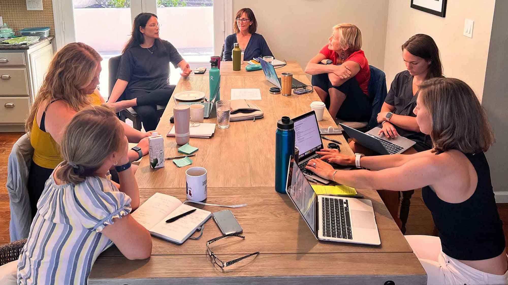 WiDS Worldwide Central Team sitting around a table