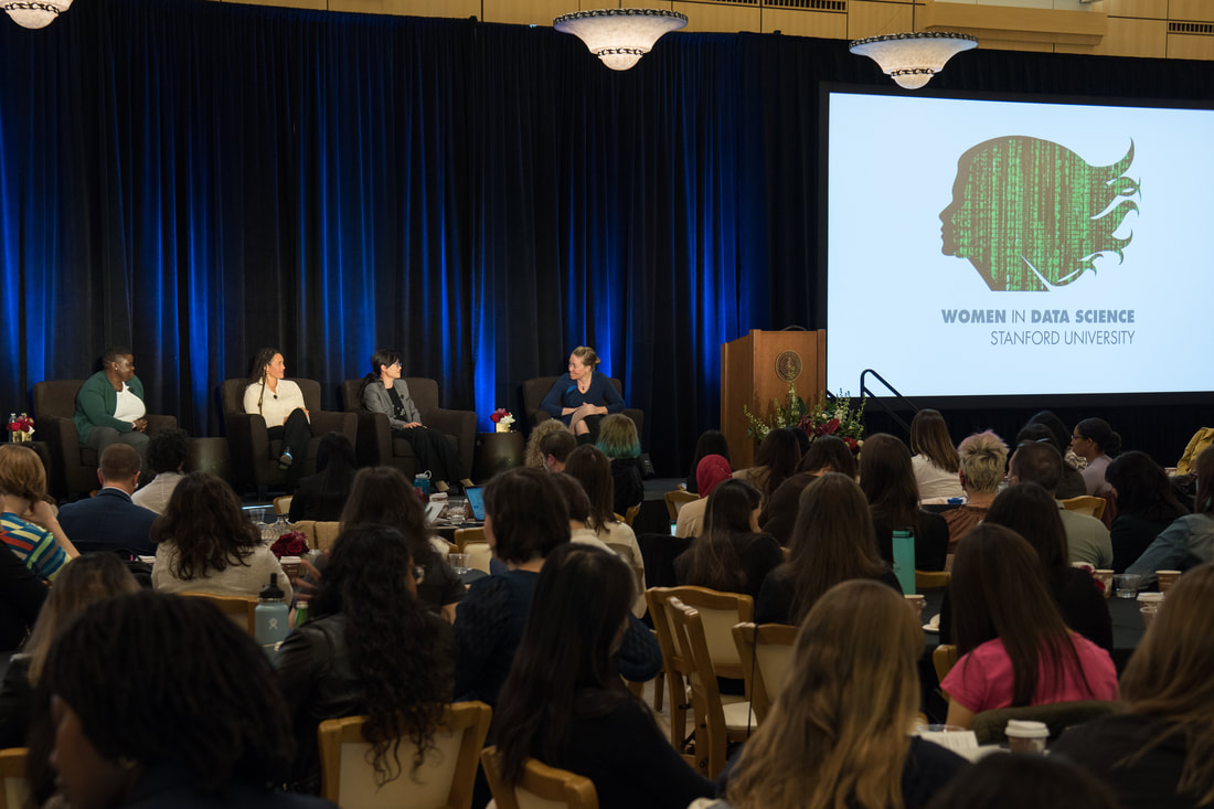 Four women on stage at the Stanford 2022 Conference Panel